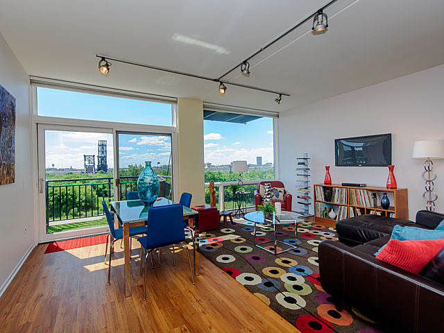 61 West 15th Street, Unit 607 Chicago, IL 60605 - Photo 6 of 23 a living room with furniture and a floor to ceiling window
