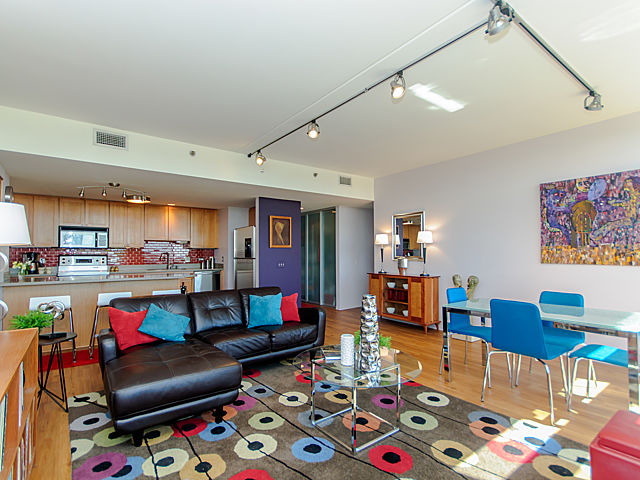 61 West 15th Street, Unit 607 Chicago, IL 60605 - Photo 7 of 23 a living room with furniture and a flat screen tv
