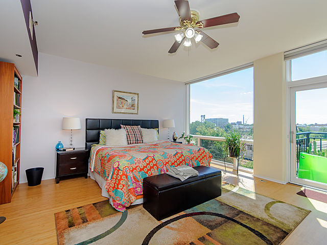 61 West 15th Street, Unit 607 Chicago, IL 60605 - Photo 9 of 23 a bedroom with bed couch and window