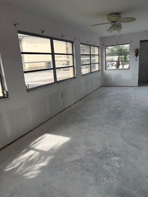 4557 Garnet Drive, Unit 102 New Port Richey, FL 34652 - Photo 4 of 14 an empty room with windows