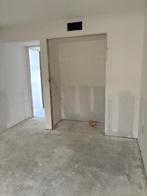 4557 Garnet Drive, Unit 102 New Port Richey, FL 34652 - Photo 5 of 14 an empty room with an empty space