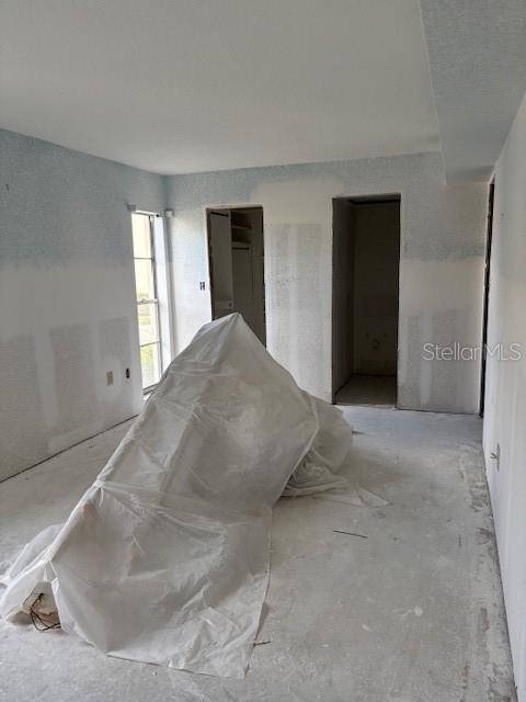 4557 Garnet Drive, Unit 102 New Port Richey, FL 34652 - Photo 6 of 14 a view of a livingroom with wooden floor and cabinet