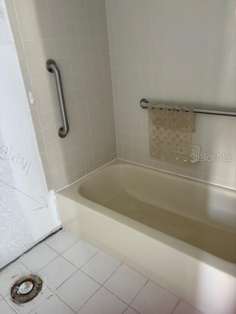 4557 Garnet Drive, Unit 102 New Port Richey, FL 34652 - Photo 7 of 14 a bathroom with a tub