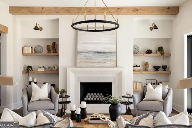 a living room with furniture a window and a fireplace