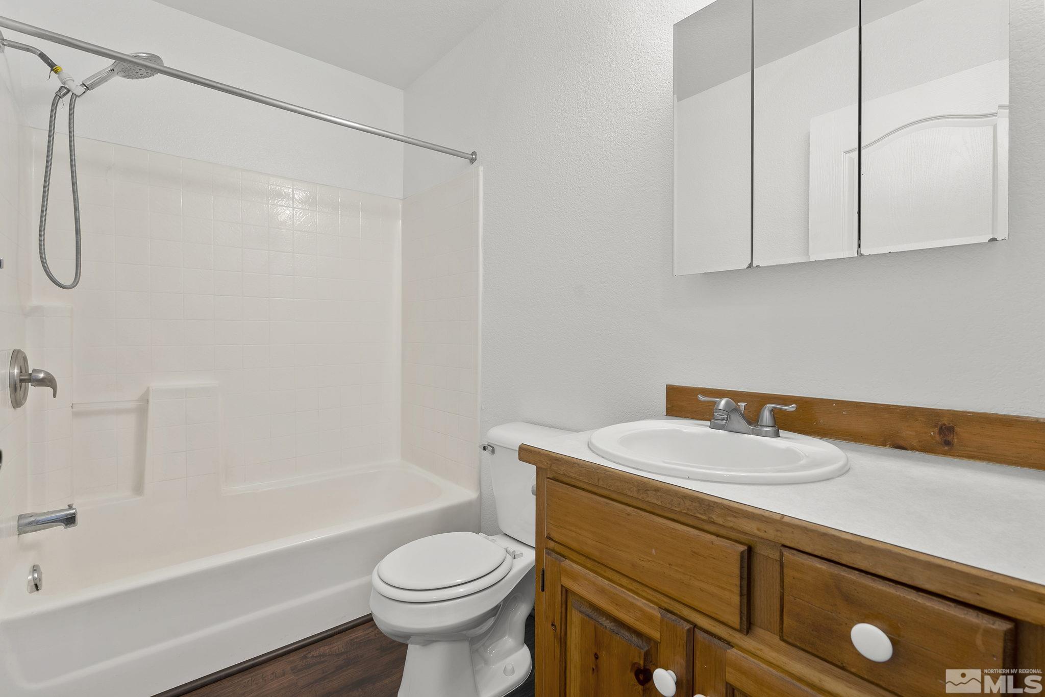 8545 Gate Street Reno, NV 89506 - Photo 14 of 29 a bathroom with a sink a toilet and shower