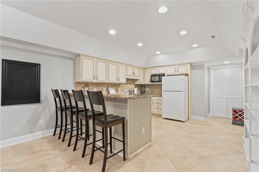 8505 Case Ridge Drive Oak Ridge, NC 27310 - Photo 4 of 35 Second full kitchen located in basement