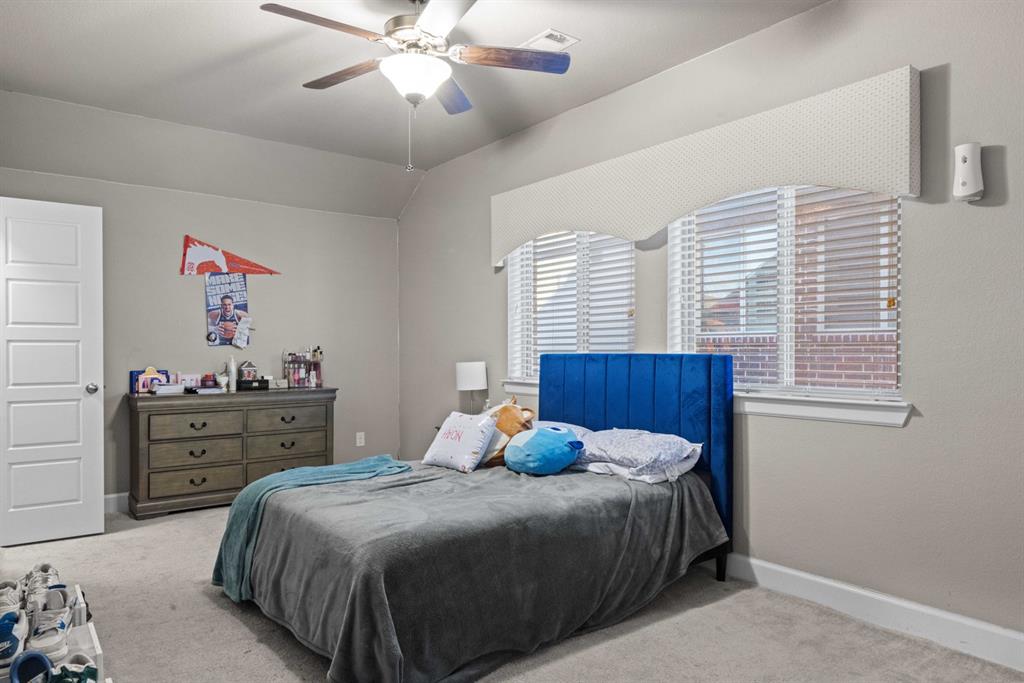5417 Harbour Road Richardson, TX 75082 - Photo 15 of 23 a bedroom with a bed and a dresser
