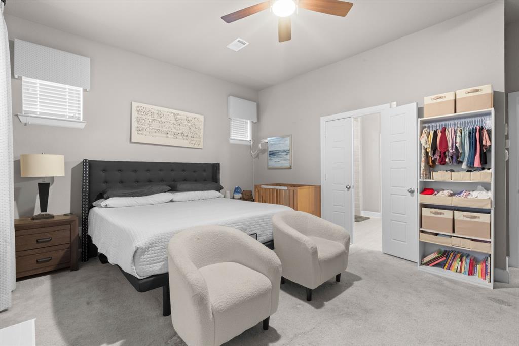 5417 Harbour Road Richardson, TX 75082 - Photo 18 of 23 a bedroom with bed and a chandelier