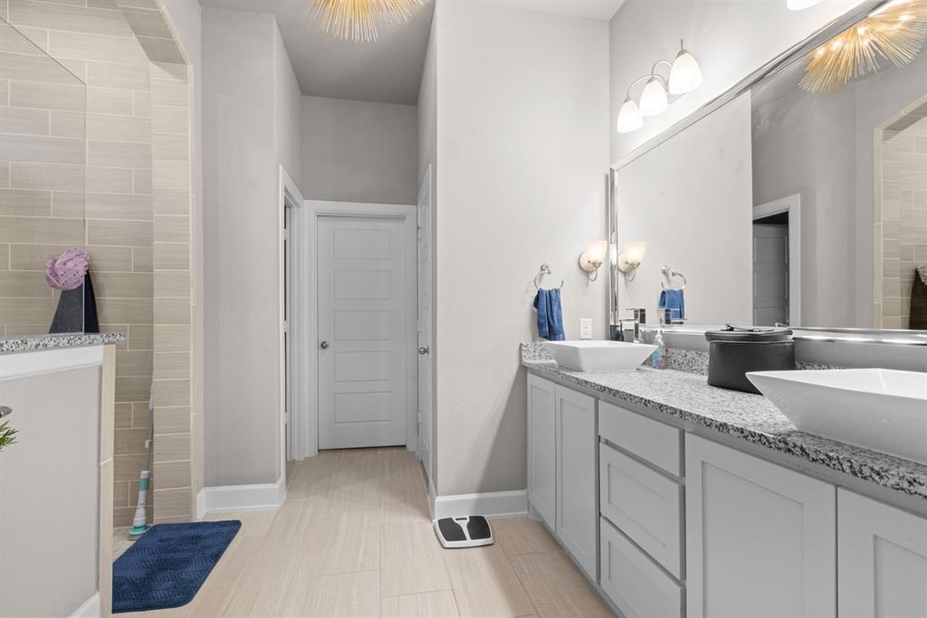 5417 Harbour Road Richardson, TX 75082 - Photo 19 of 23 a bathroom with a sink and a mirror