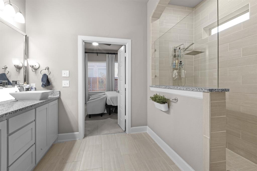 5417 Harbour Road Richardson, TX 75082 - Photo 20 of 23 a bathroom with a sink and mirror