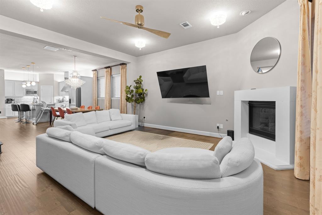 5417 Harbour Road Richardson, TX 75082 - Photo 2 of 23 a living room with furniture and a flat screen tv