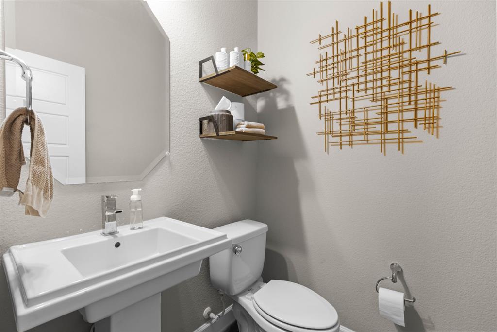 5417 Harbour Road Richardson, TX 75082 - Photo 21 of 23 a bathroom with a sink and mirror with toilet