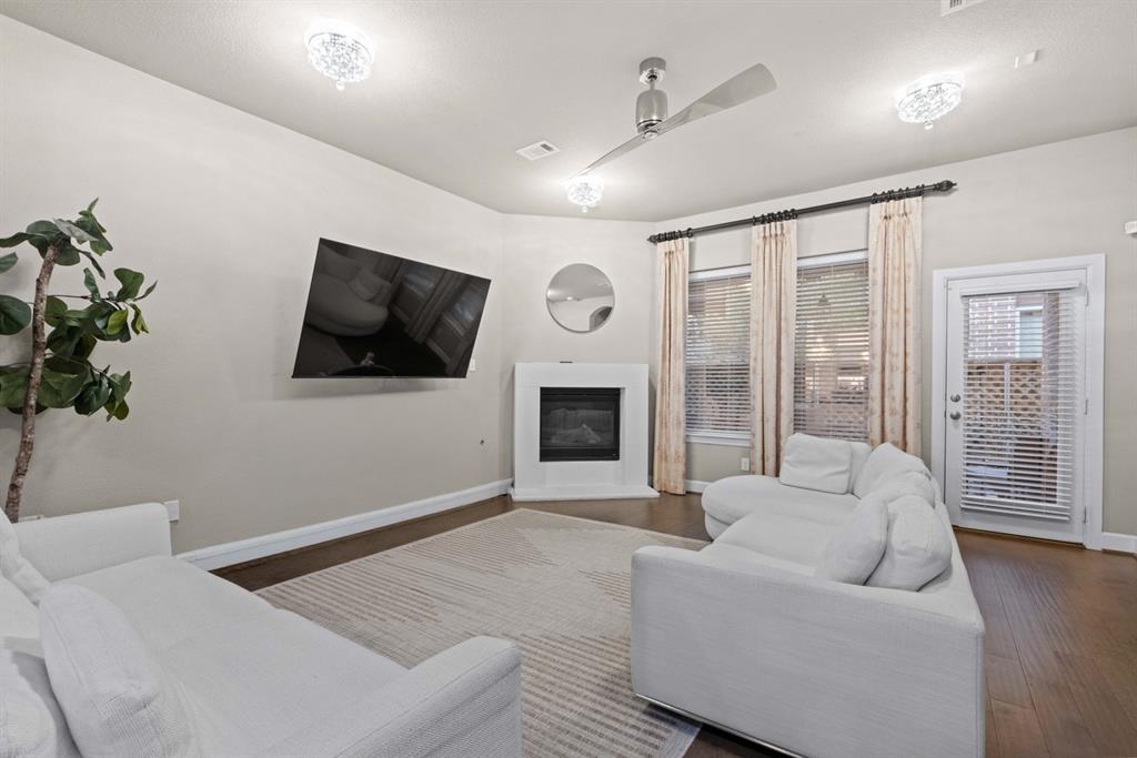5417 Harbour Road Richardson, TX 75082 - Photo 3 of 23 a living room with furniture and a flat screen tv