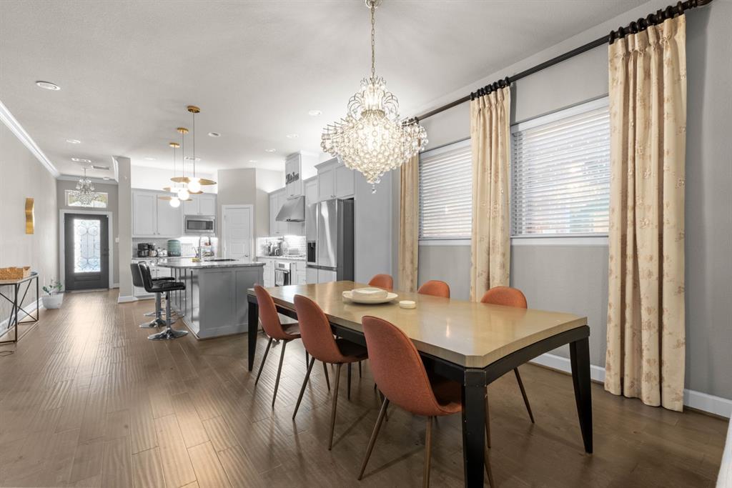 5417 Harbour Road Richardson, TX 75082 - Photo 7 of 23 a view of a dining room with furniture window and wooden floor