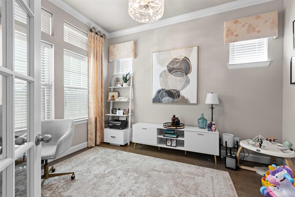 5417 Harbour Road Richardson, TX 75082 - Photo 8 of 23 a view of a bedroom with workspace and a window