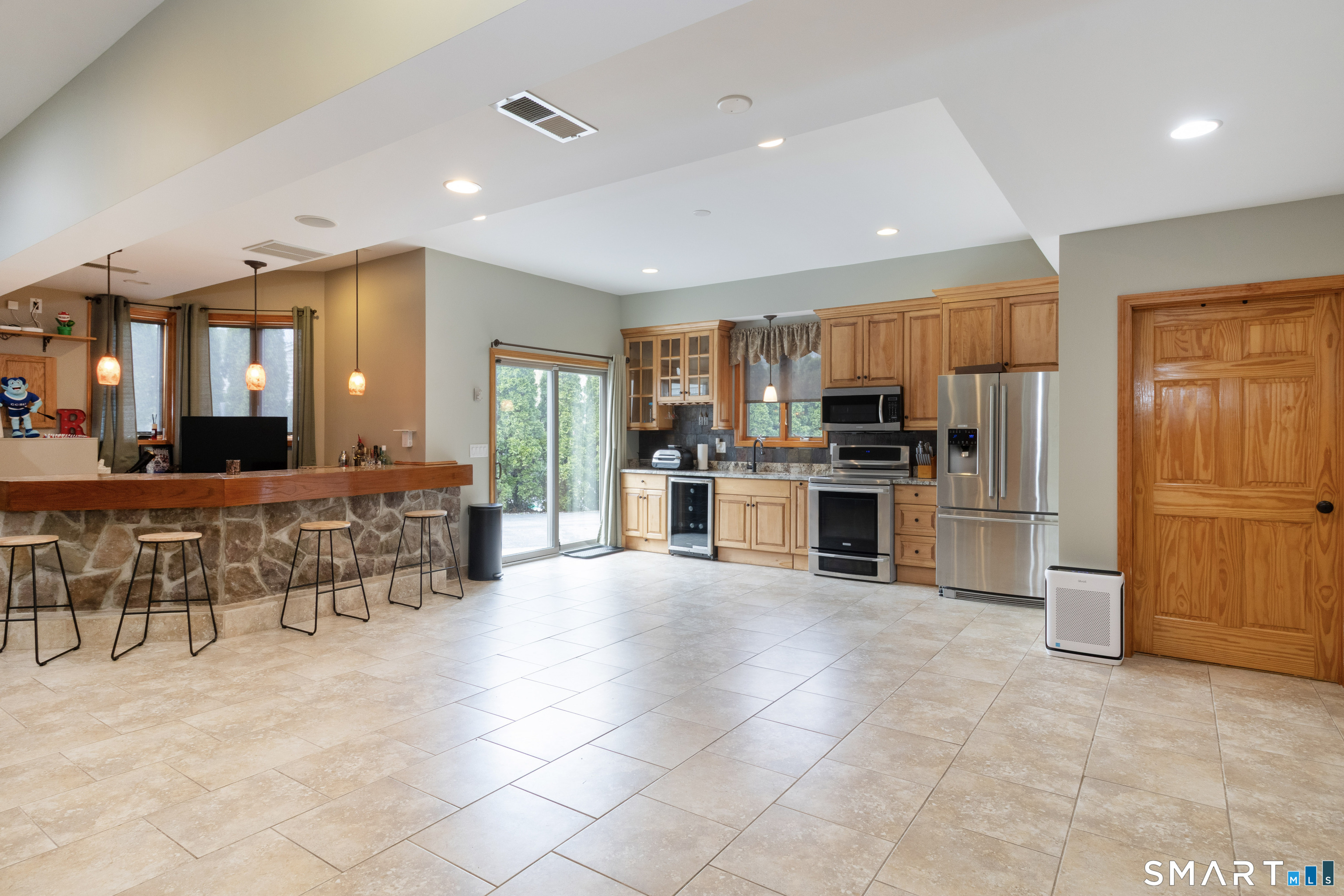 113 Pinnacle Road Plainville, CT 06062 - Photo 15 of 36 This space is so flexible to be whatever you want it to be. Separate entrances from sliders and giant lower garage.