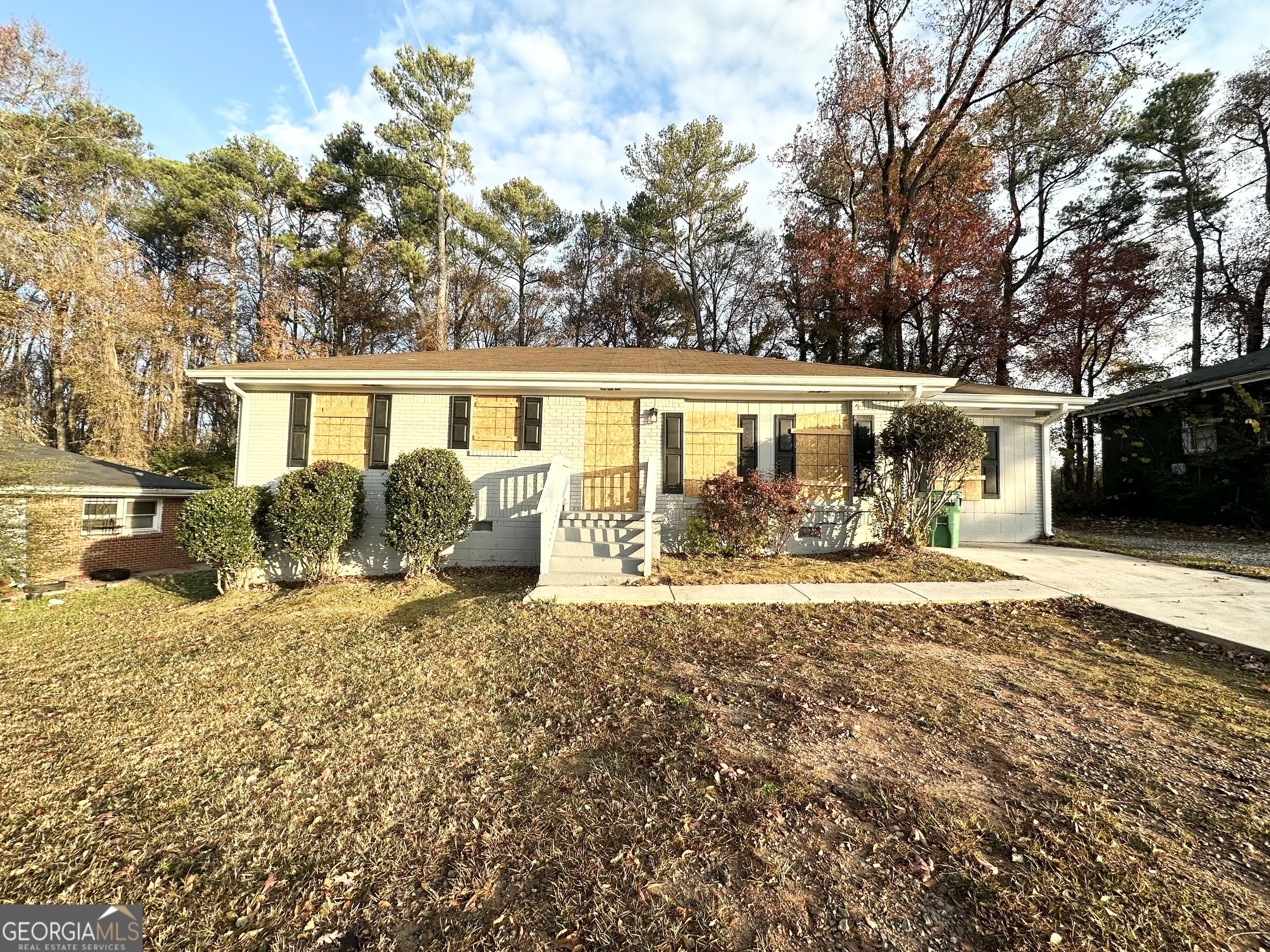 2252 Brannen Road Southeast Atlanta, GA 30316 - Photo 2 of 3 a front view of a house with a yard and garage