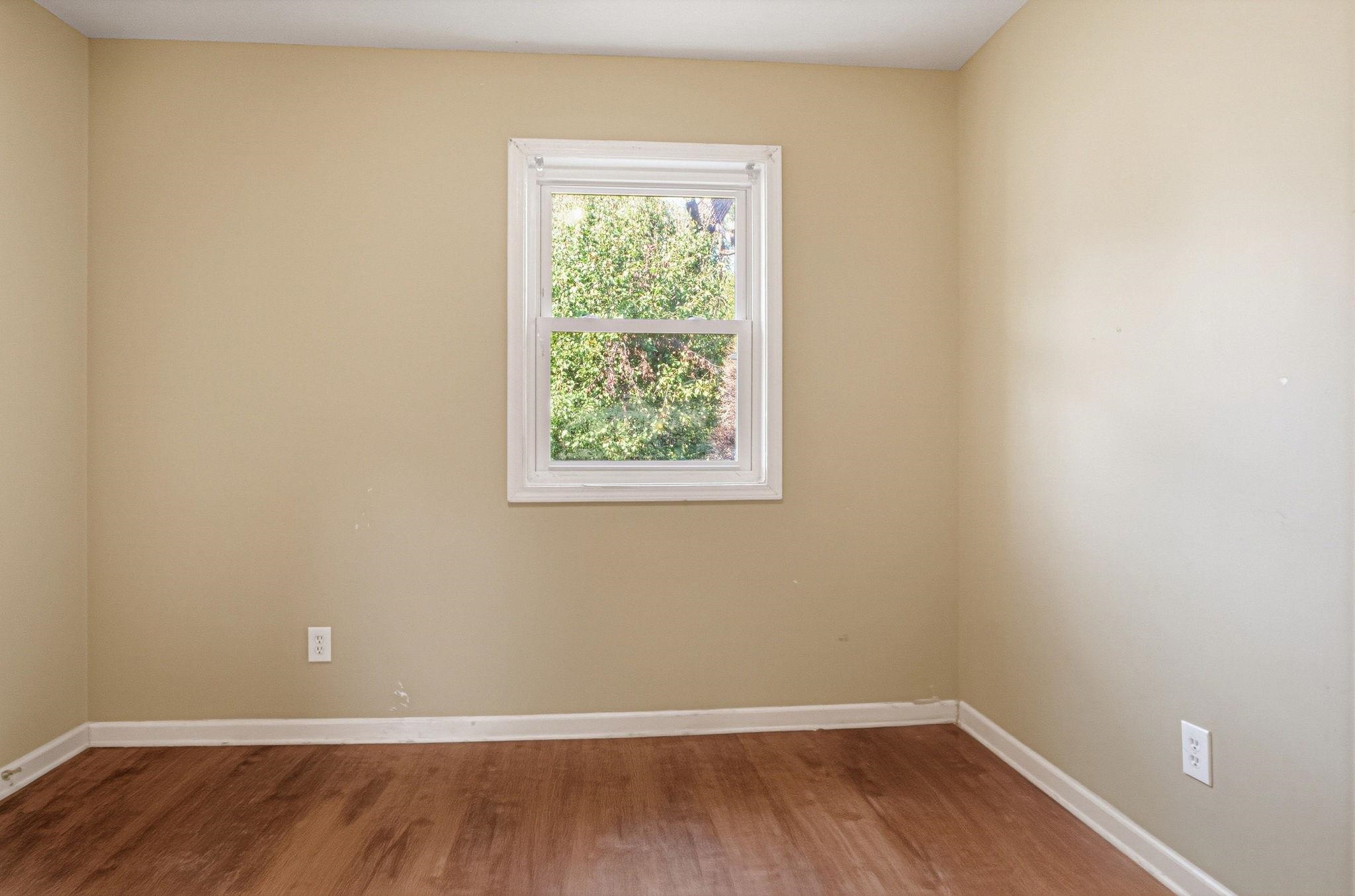 4562 Tulane Road Memphis, TN 38109 - Photo 25 of 32 Wood-finish flooring with neutral wall paint and white trim