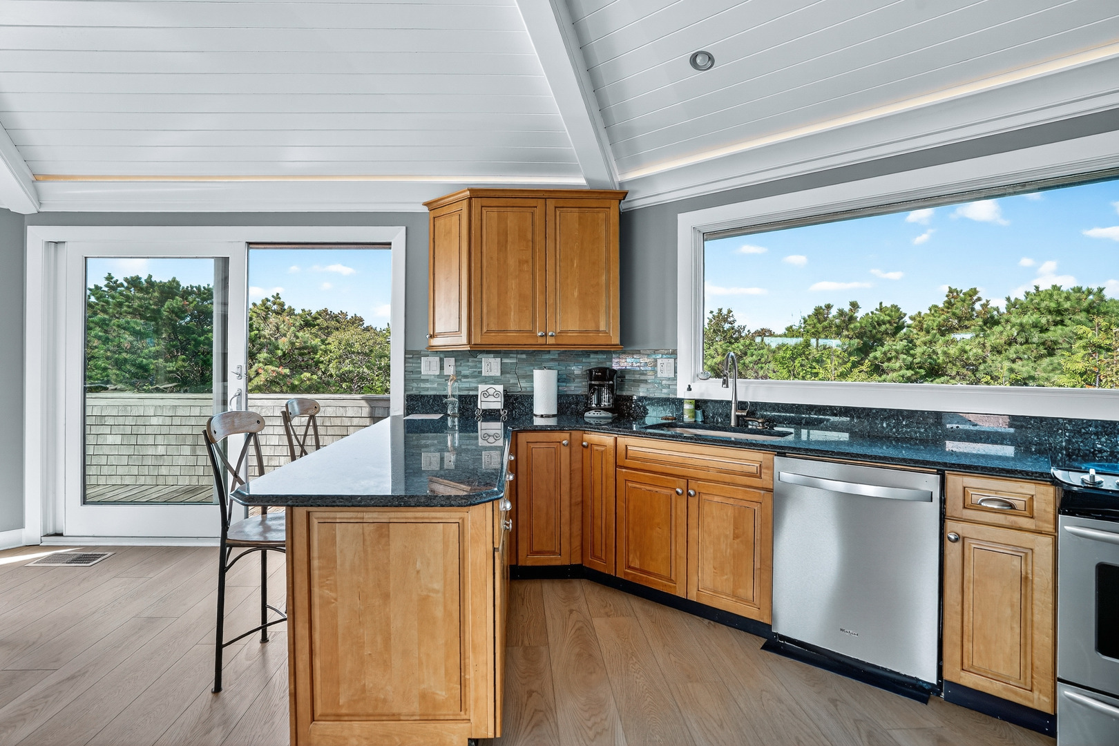 76 Washque Avenue Edgartown, MA 02539 - Photo 18 of 50 a kitchen with stainless steel appliances granite countertop a stove a sink and a refrigerator
