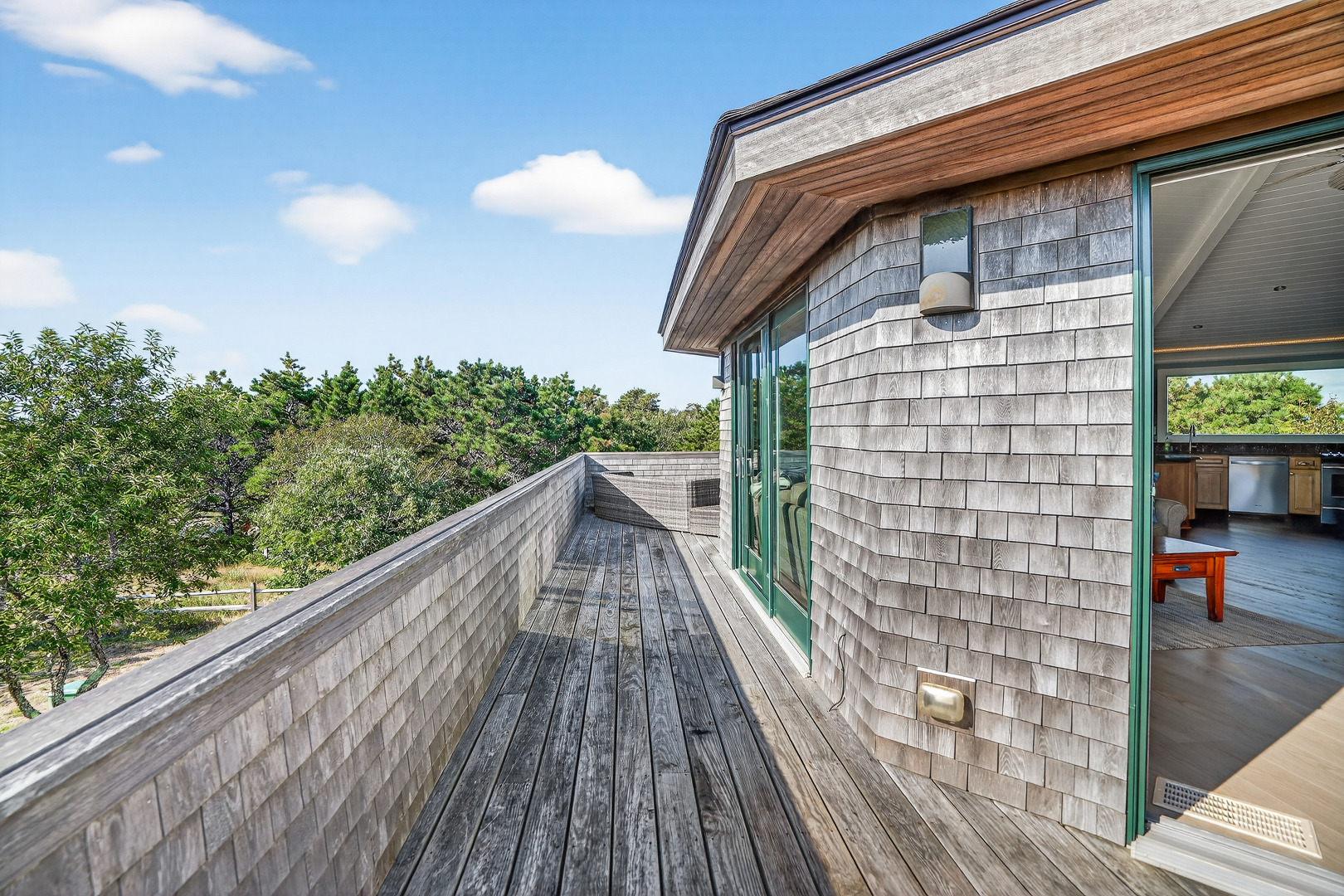 76 Washque Avenue Edgartown, MA 02539 - Photo 21 of 50 a view of balcony with wooden floor and fence