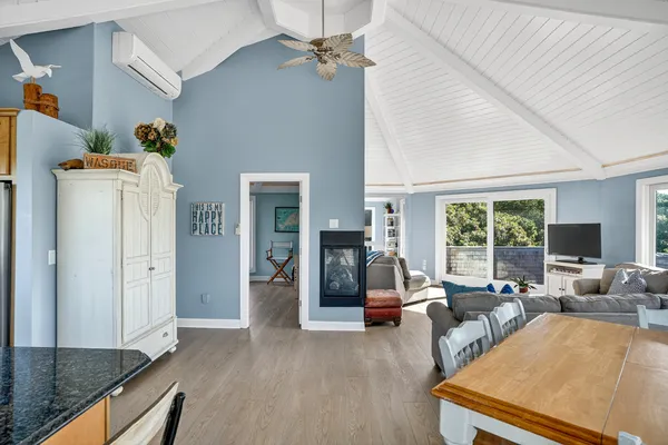 a living room with furniture and large windows
