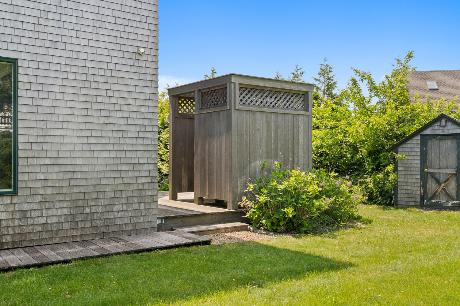 76 Washque Avenue Edgartown, MA 02539 - Photo 35 of 50 a view of a house with a yard and plants