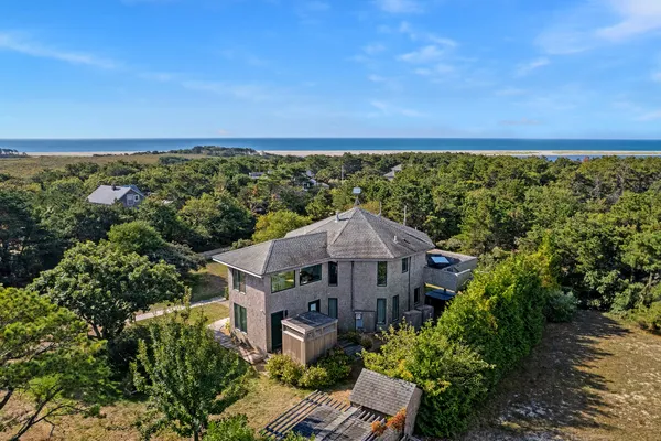an aerial view of a house with a garden