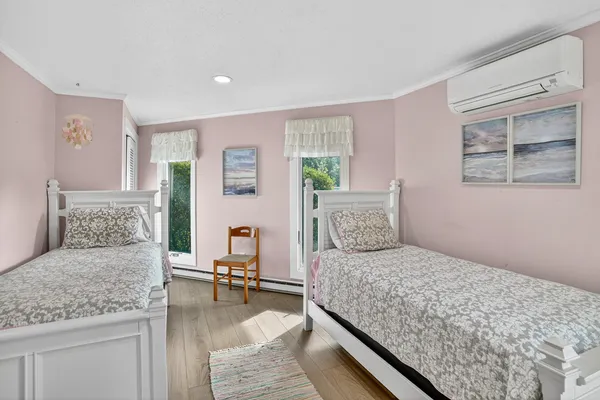 a bedroom with a large bed and a couch
