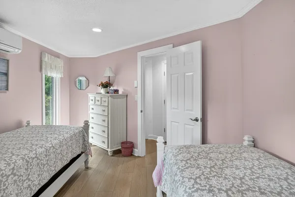 a bedroom with a bed and a dresser