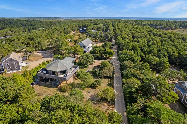 an aerial view of houses with yard