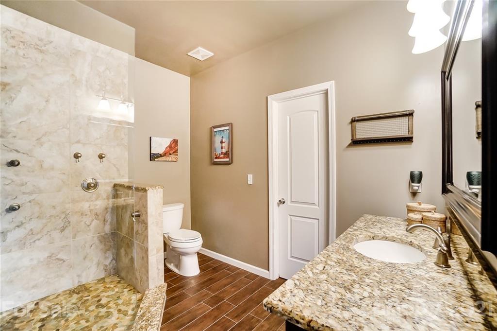 339 Lancaster Estate Road Indian Land, SC 29707 - Photo 20 of 48 a bedroom with a bed and a couch