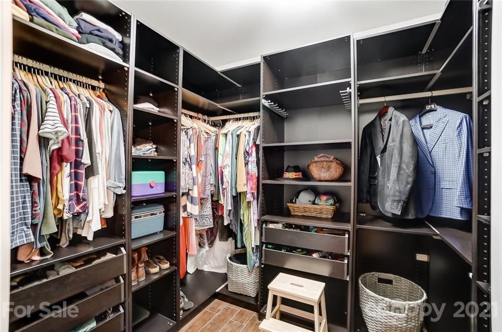339 Lancaster Estate Road Indian Land, SC 29707 - Photo 23 of 48 a view of walk in closet with clothes and shoes