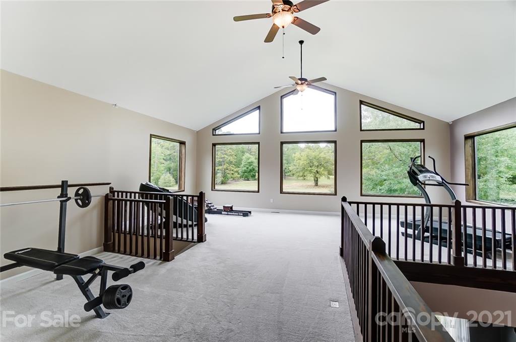 339 Lancaster Estate Road Indian Land, SC 29707 - Photo 26 of 48 a view of a room with gym equipment