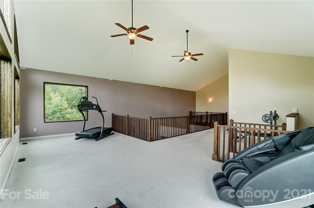 339 Lancaster Estate Road Indian Land, SC 29707 - Photo 27 of 48 a room with lots of wooden floor and windows