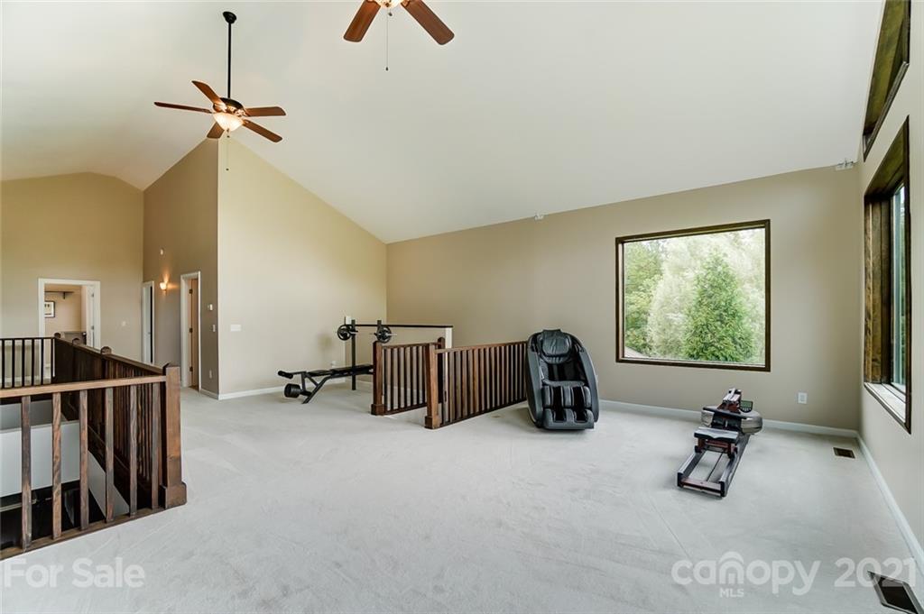 339 Lancaster Estate Road Indian Land, SC 29707 - Photo 29 of 48 a room with gym equipment and a large window