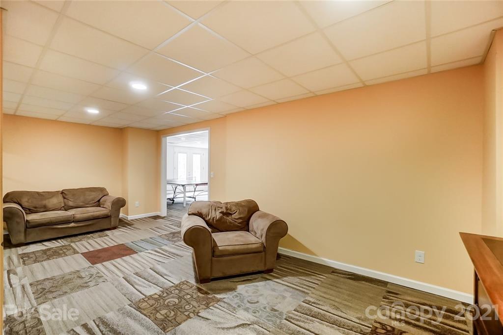 339 Lancaster Estate Road Indian Land, SC 29707 - Photo 35 of 48 a living room with furniture and a couch