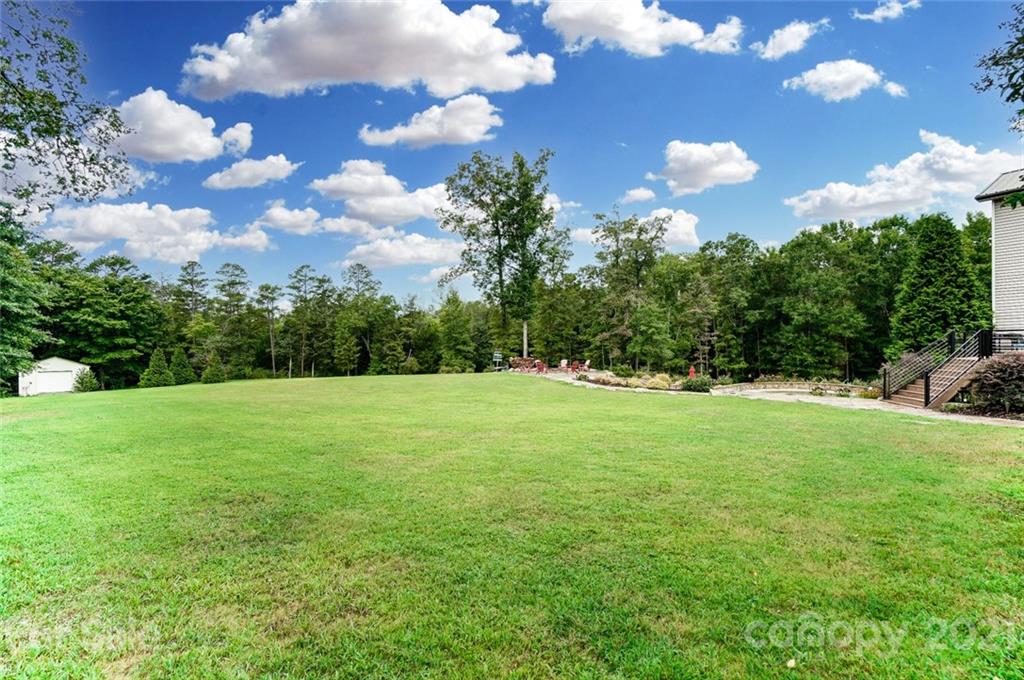 339 Lancaster Estate Road Indian Land, SC 29707 - Photo 43 of 48 a view of a grassy field with trees