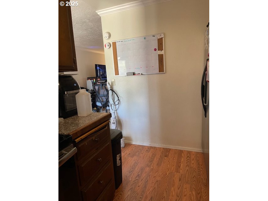 353 Donald Terrace Myrtle Creek, OR 97457 - Photo 15 of 18 a view of workspace with wooden floor