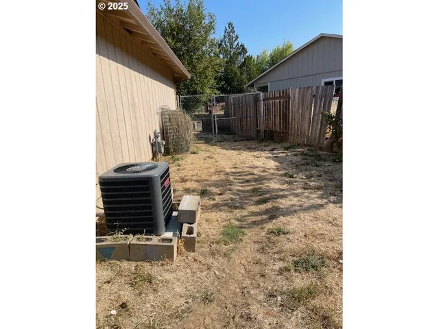 a room with a bench and trees