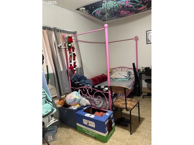 a view of living room with furniture and musical instruments