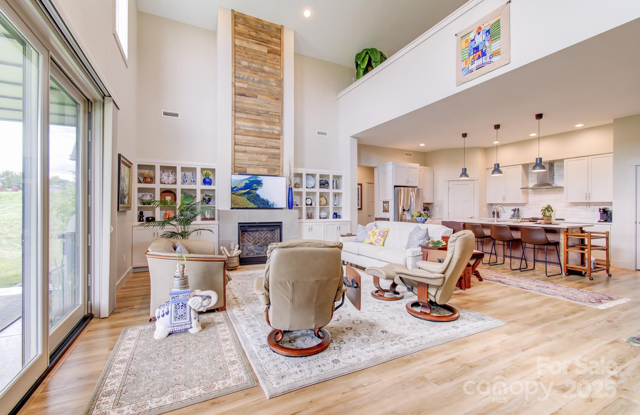 147 Majestic Ridge Road Mills River, NC 28759 - Photo 11 of 48 a living room with furniture and a large window