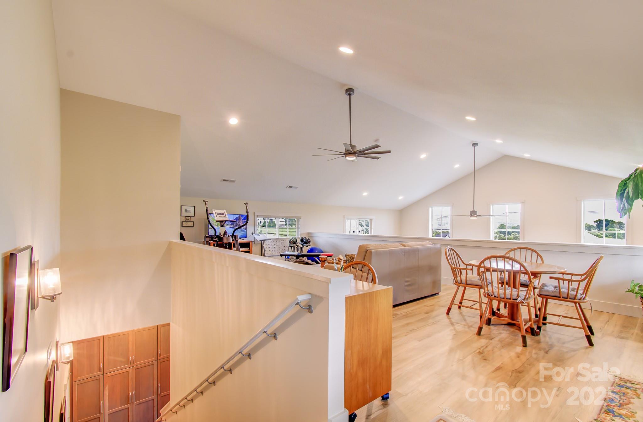 147 Majestic Ridge Road Mills River, NC 28759 - Photo 15 of 48 a view of a dining room with furniture and a kitchen view