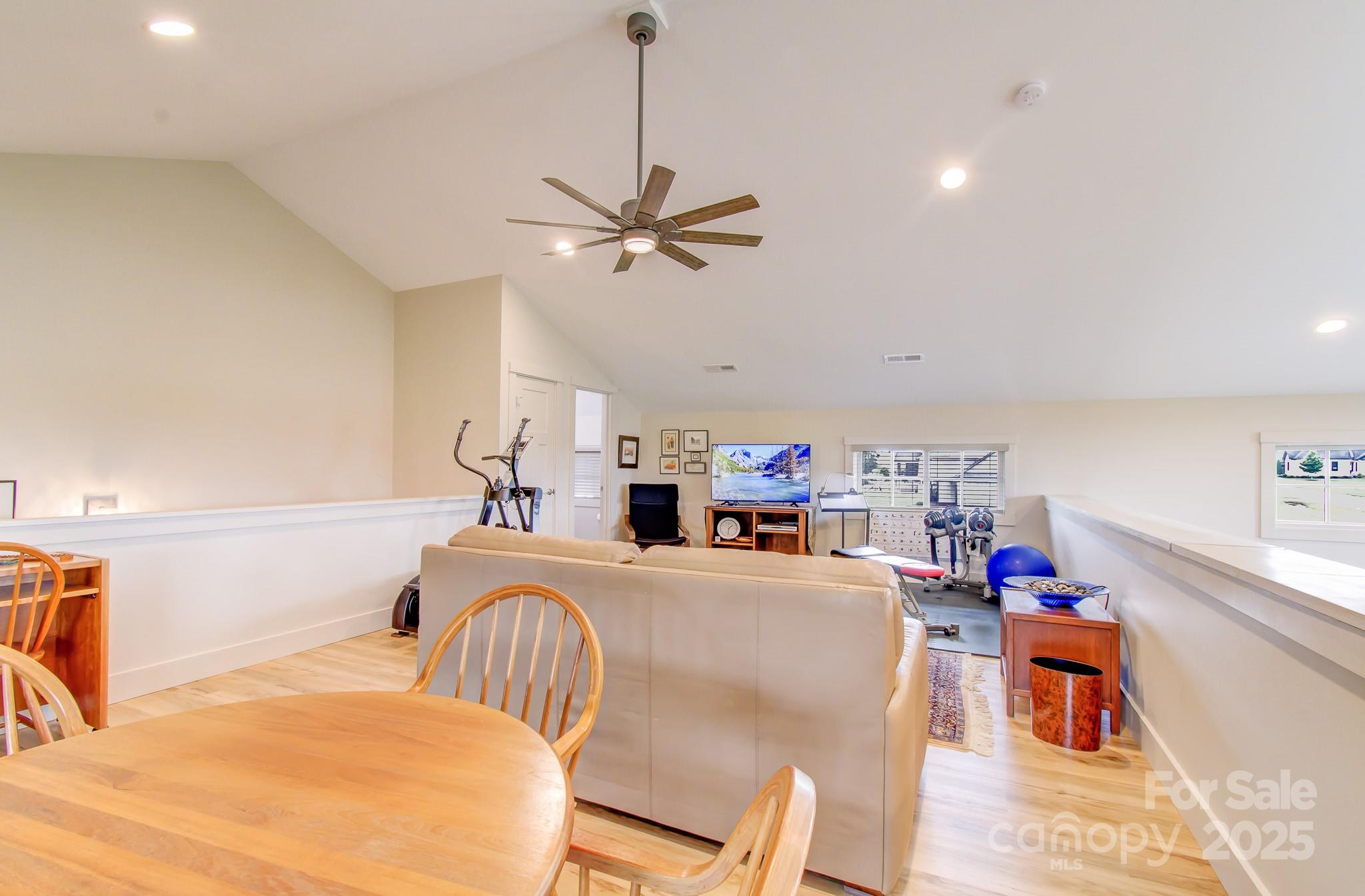 147 Majestic Ridge Road Mills River, NC 28759 - Photo 17 of 48 a bedroom with furniture a bed and a chandelier