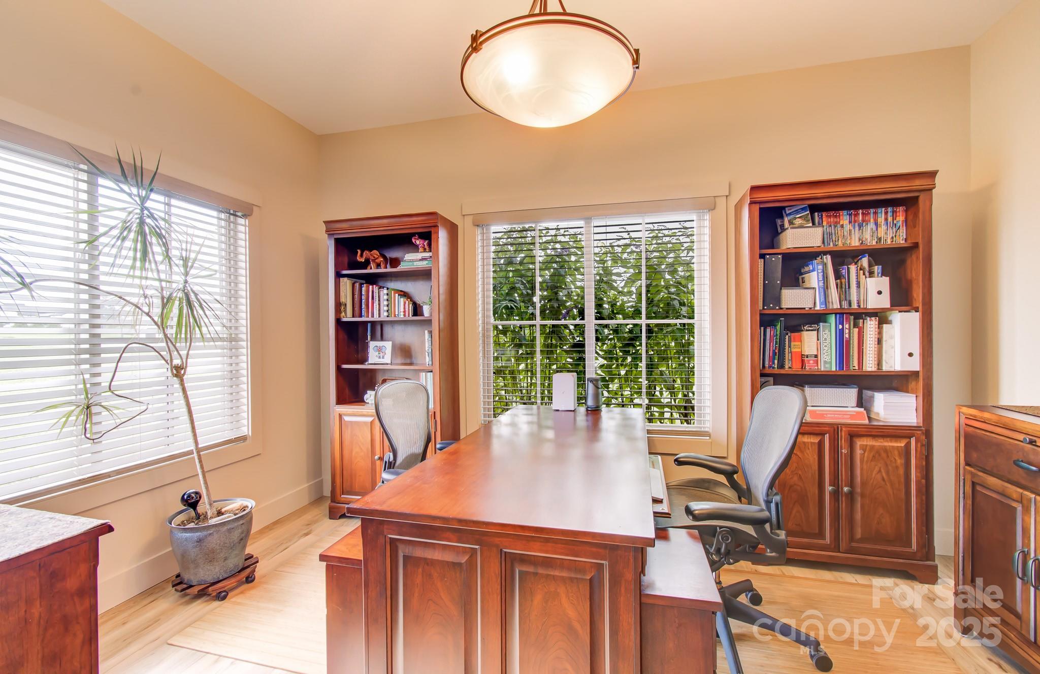 147 Majestic Ridge Road Mills River, NC 28759 - Photo 18 of 48 a view of a workspace with furniture and a window