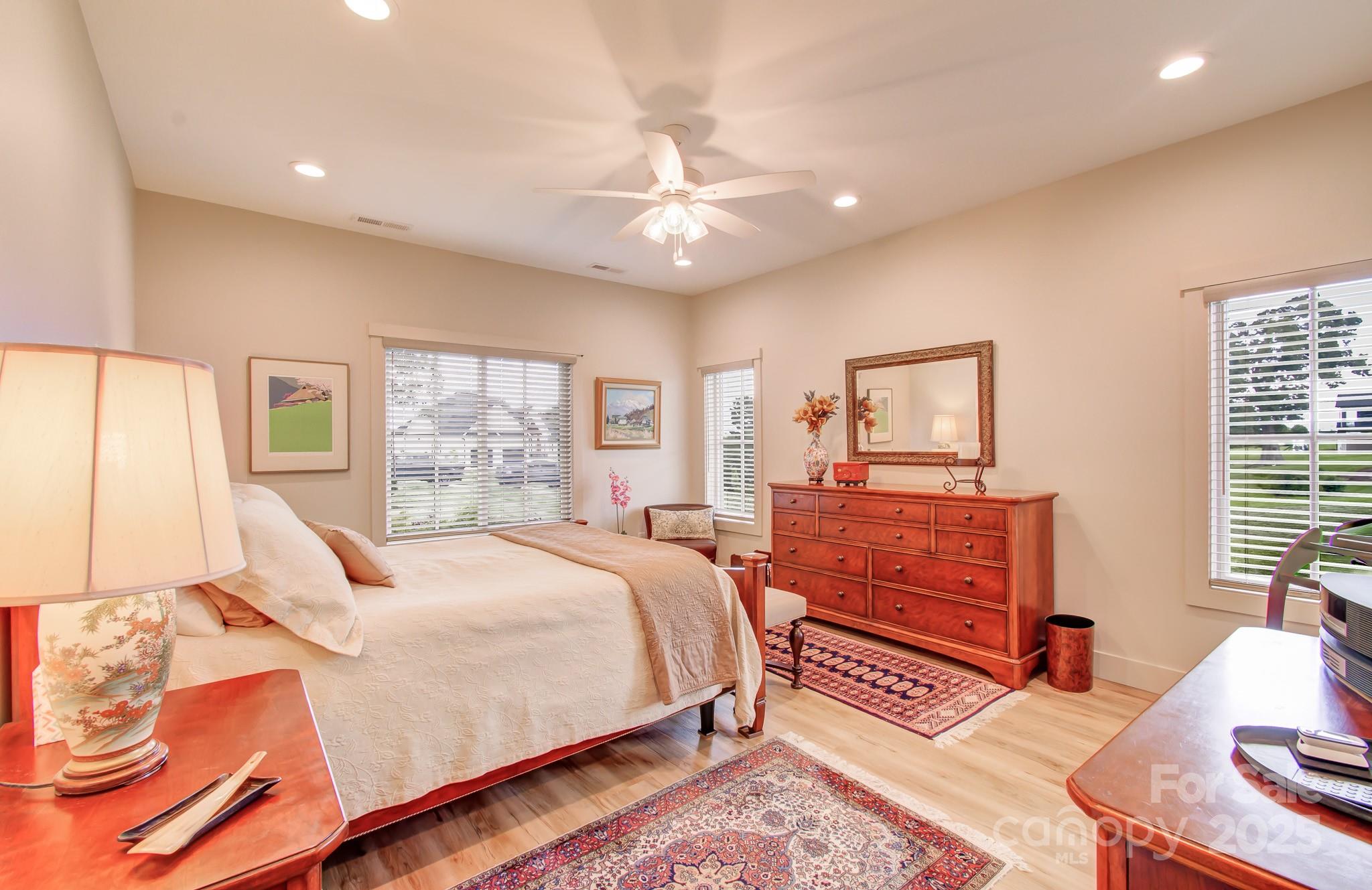 147 Majestic Ridge Road Mills River, NC 28759 - Photo 20 of 48 a bedroom with a large bed and a window