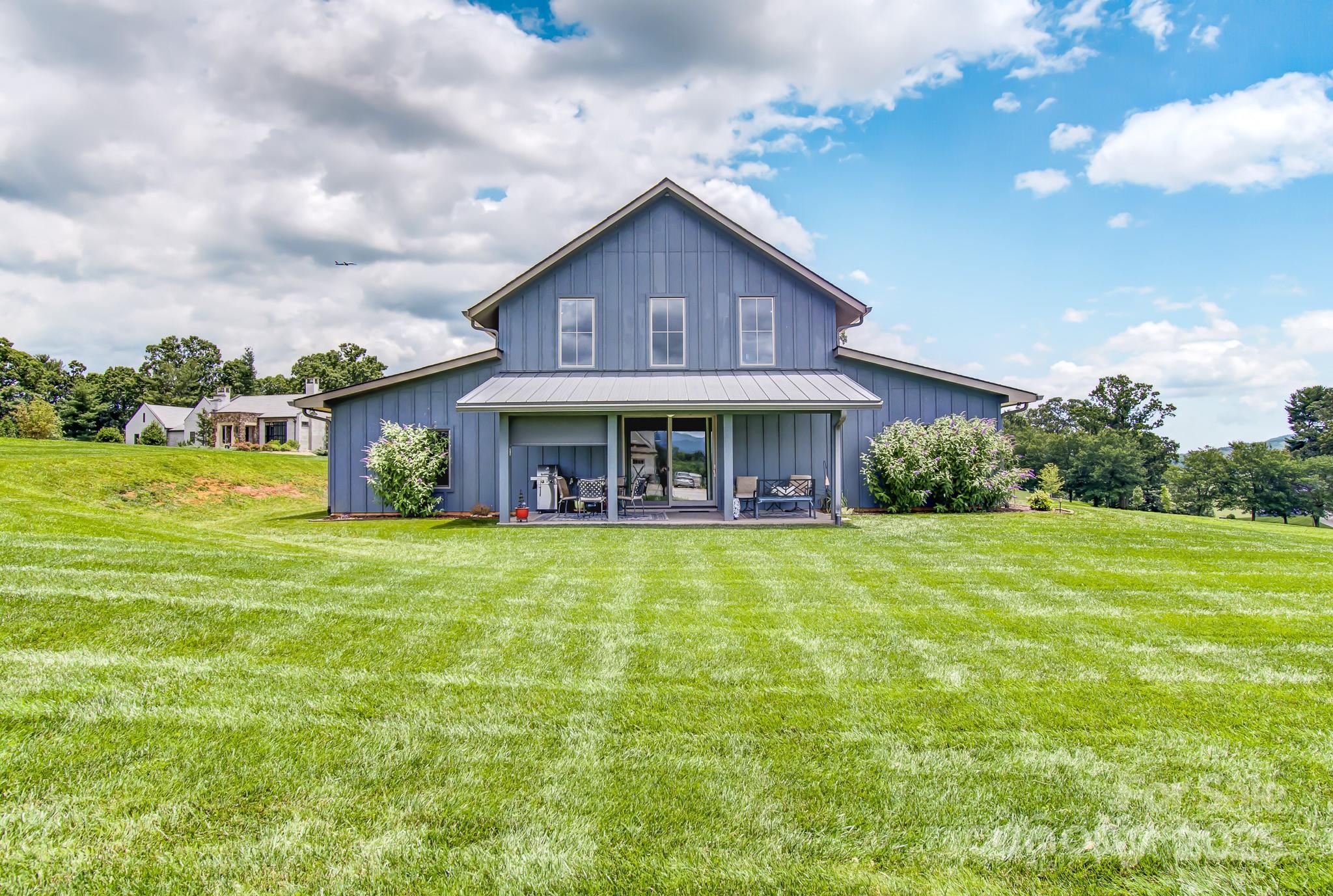 147 Majestic Ridge Road Mills River, NC 28759 - Photo 2 of 48 a front view of a house with a yard