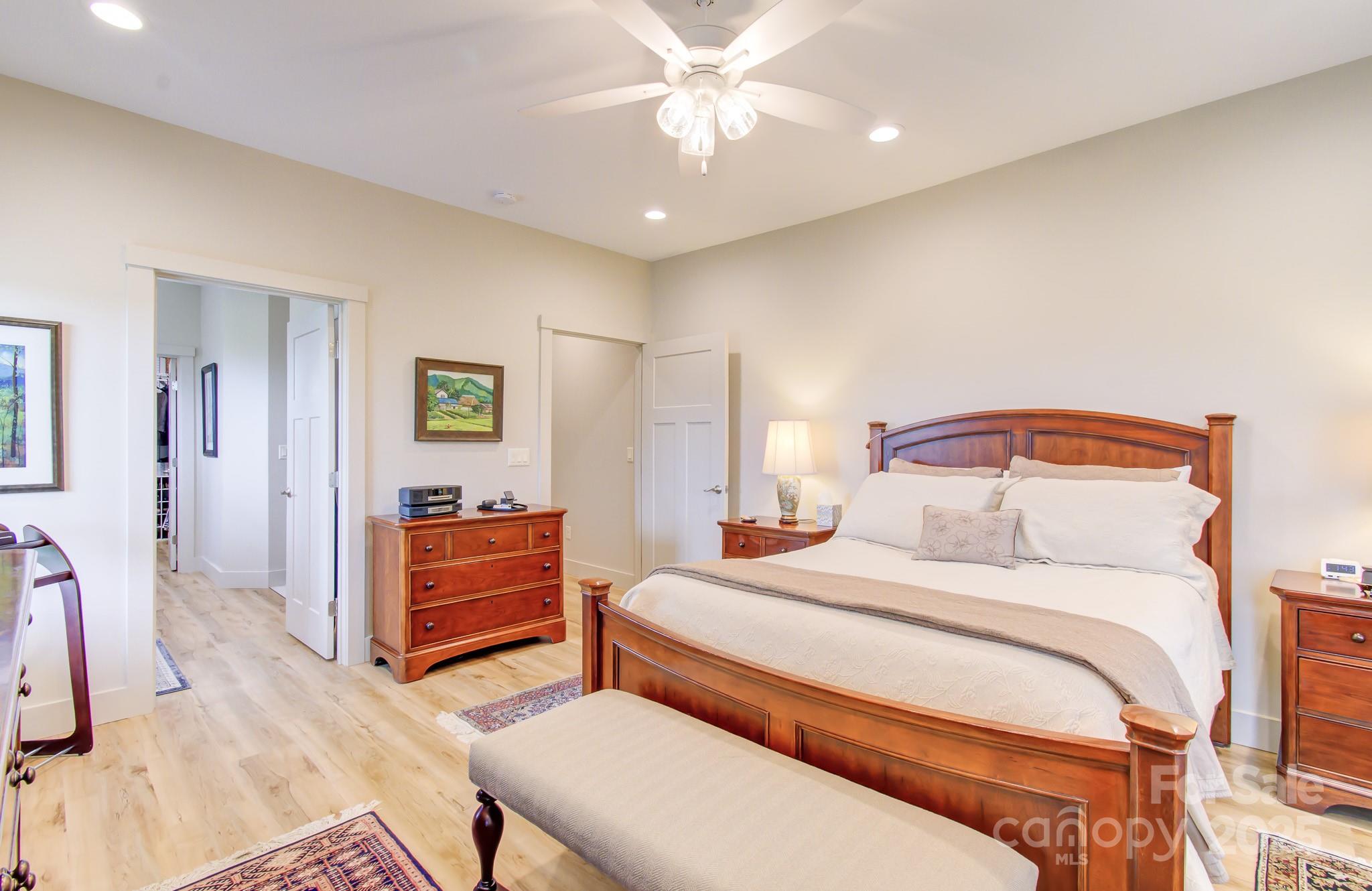 147 Majestic Ridge Road Mills River, NC 28759 - Photo 21 of 48 a bedroom with a bed and a dresser