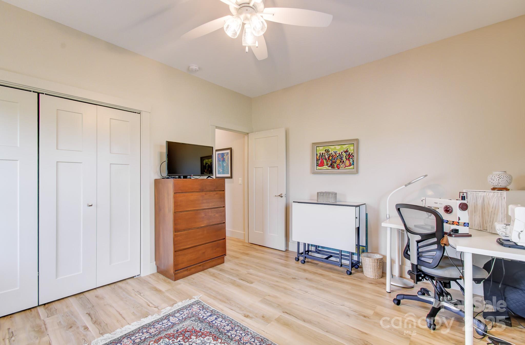 147 Majestic Ridge Road Mills River, NC 28759 - Photo 29 of 48 a bedroom with furniture and a window