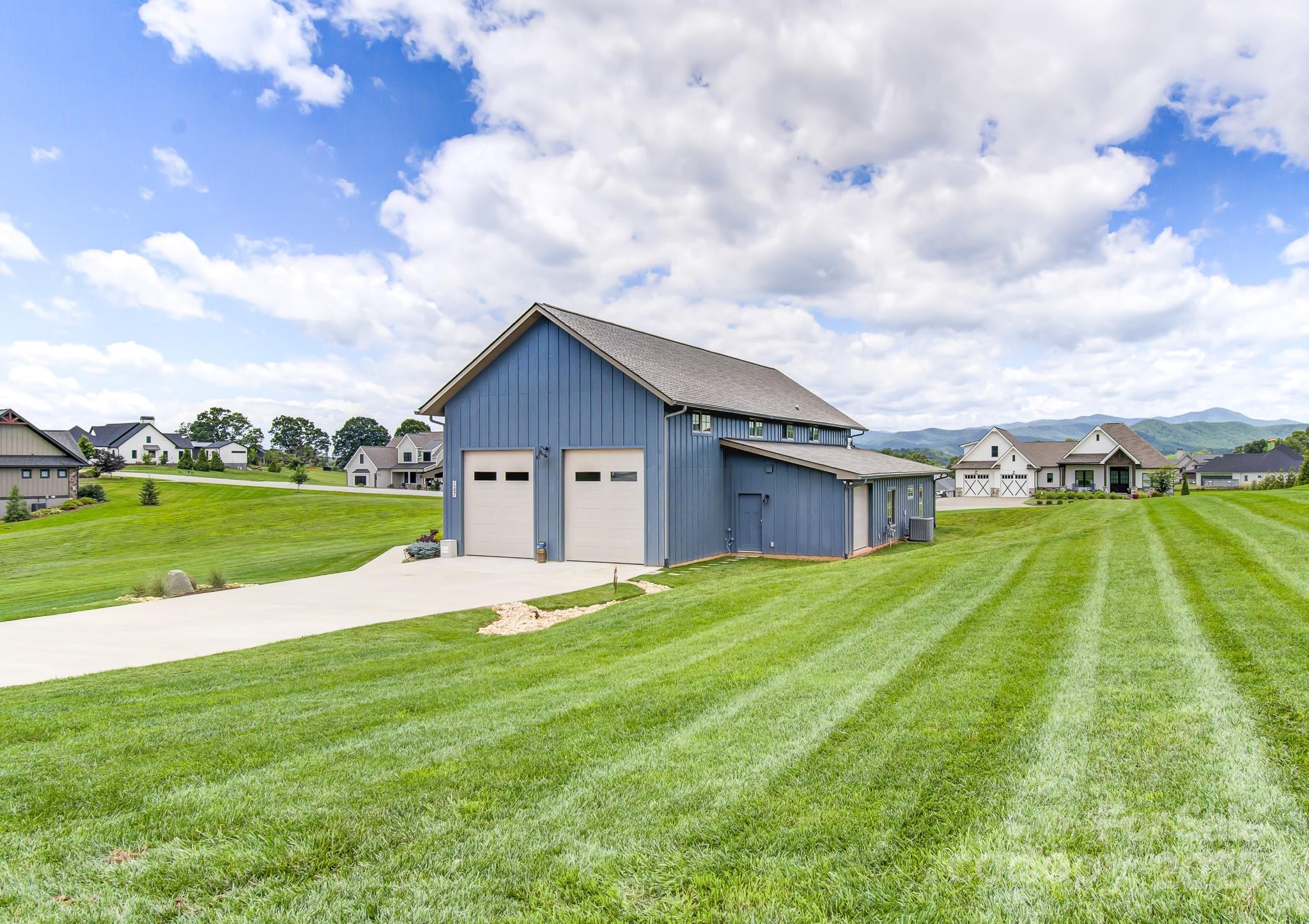 147 Majestic Ridge Road Mills River, NC 28759 - Photo 32 of 48 a view of an house with backyard and entertaining space