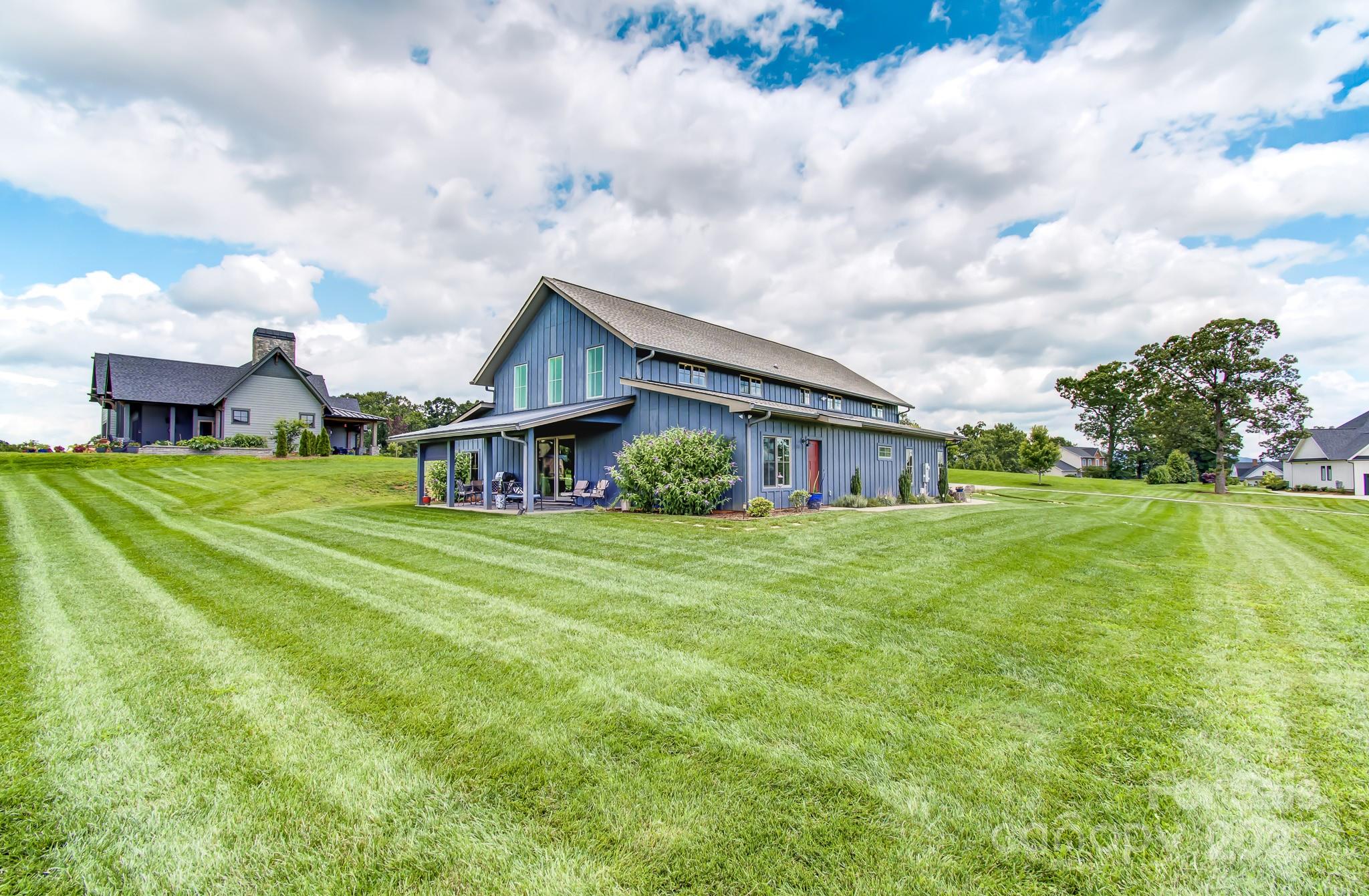147 Majestic Ridge Road Mills River, NC 28759 - Photo 35 of 48 a view of a house with a big yard plants and large trees